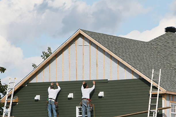 Professional Vinyl Siding technician working in Riverside, NY